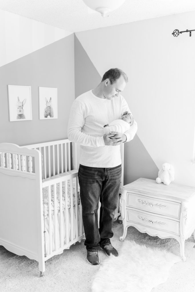 Colorado Lifestyle Newborn Photos Light and Airy Elena Spraguer Photography With Dad in Nursery