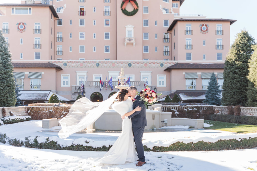 Winter Wedding at The Broadmoor Colorado Springs Veil Toss Epic Bride and Groom Portrait 