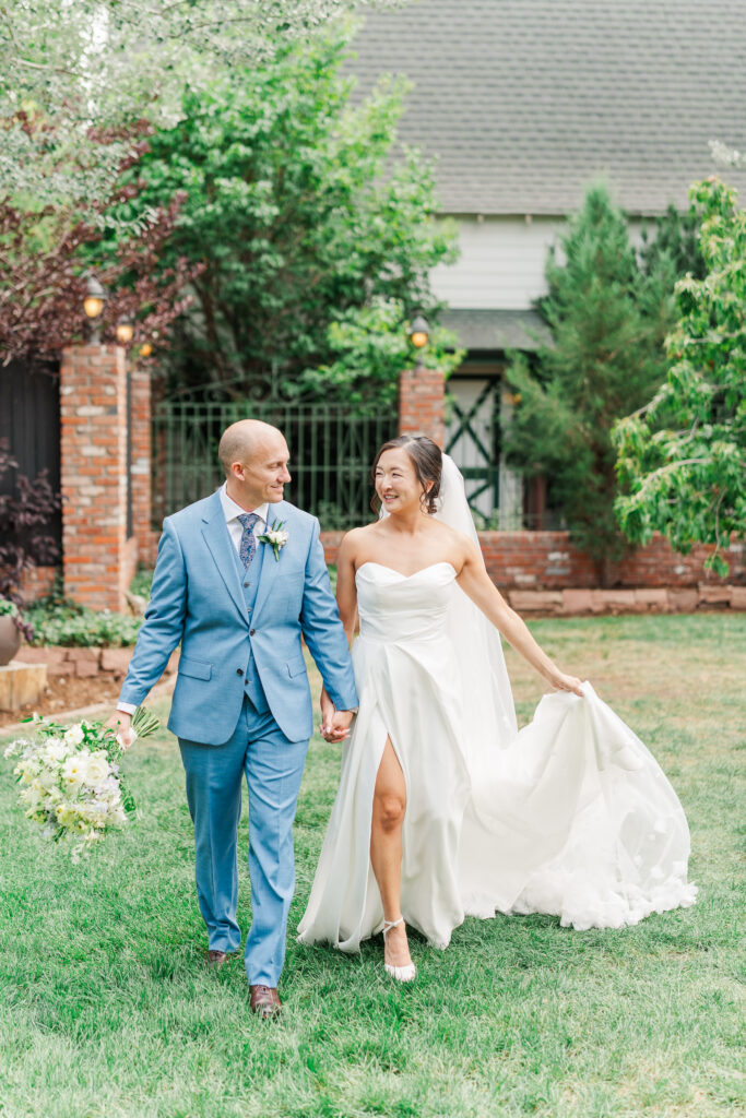 Stephanie and Sam walking through the gardens at Lionsgate Event Center
